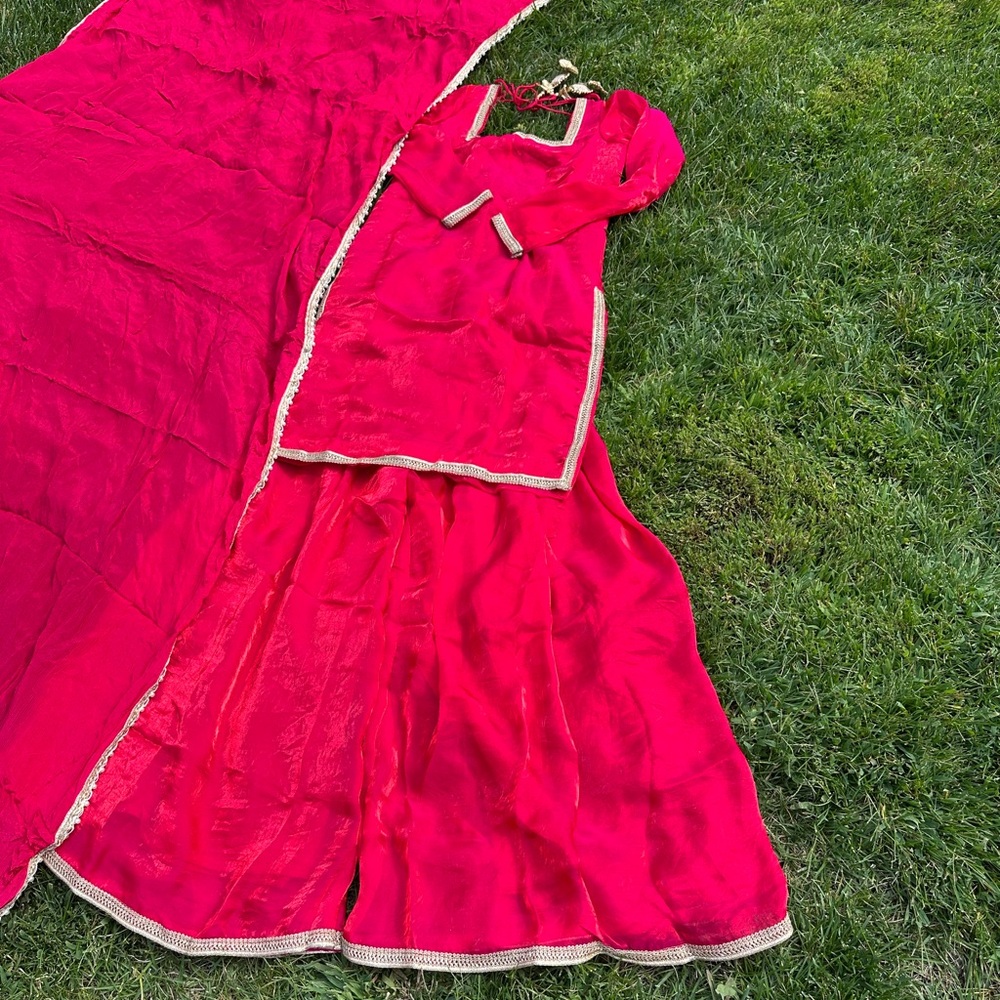 Vibrant Red Traditional Outfit with Gold Accents